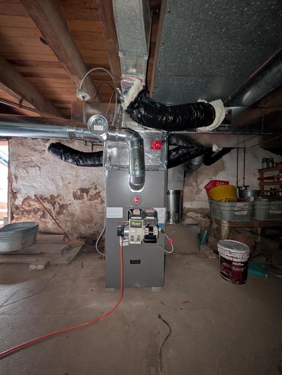Gas furnace installed in a stone-wall basement