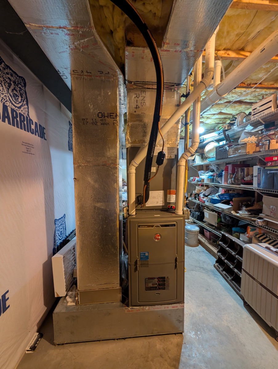A gas furnace installed in a residential basement